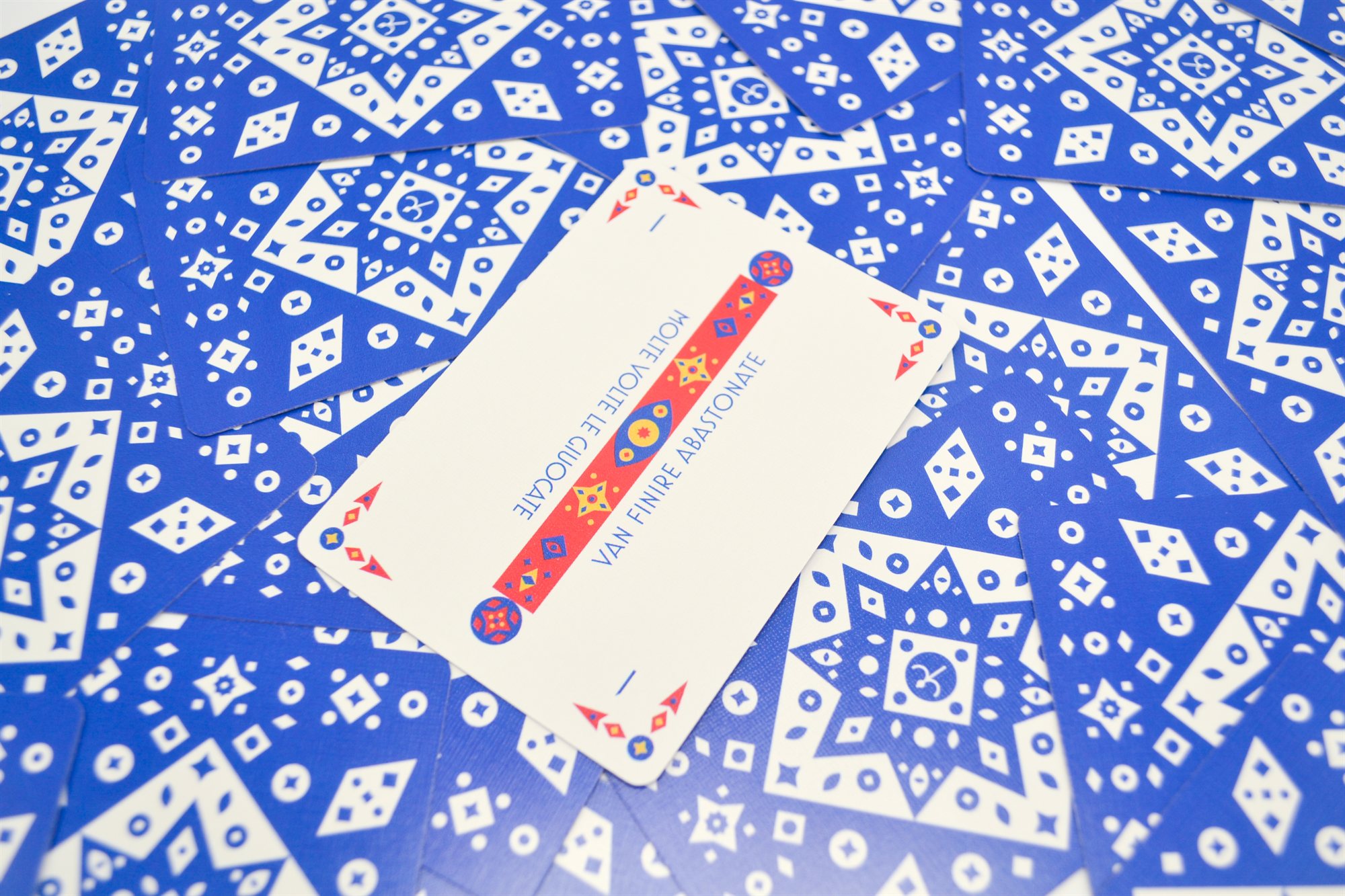 The ace of batons, a tall red and blue baton card with the motto 'Molte volte le giuocate van finire abastonate'