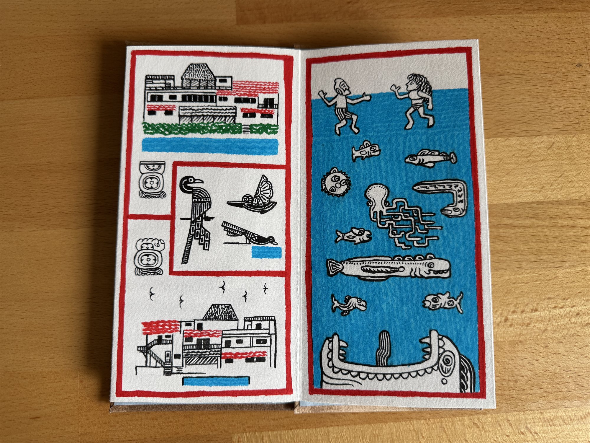 A two-page spread: line-drawn beachfront hotels and a trio of tropical birds on the left page, and two snorkelers swimming among fish, a pufferfish, an octopus, and an eel on the right page, framed at the bottom by an open, tooth-lined jaw